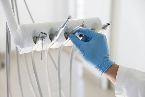 Professional Emergency Dentist technician working in Mastic Beach, NY